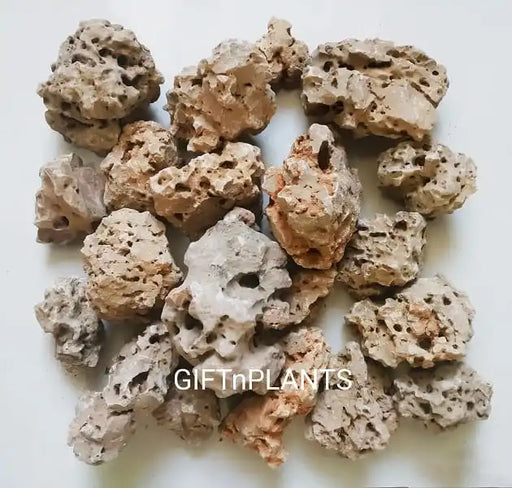 Decorative Dead Rocks with natural holes for aquarium, fish tanks, ponds, terrariums, garden plants are used as aquascaping stone bio-filter media in natural light brown colors.